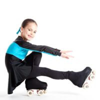 little girl with roller skates isolated on white background